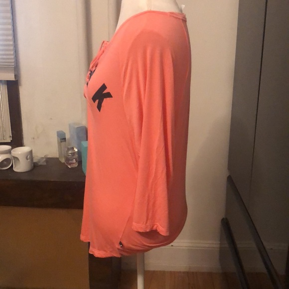 Pink Victoria’s Secret orange top that tied in the center…” pink” is in black - Picture 2 of 3